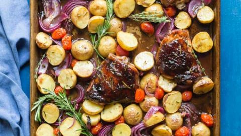 You need to try my delicious, easy, sheet pan Paleo Balsamic Chicken recipe with Roasted Potatoes, Red Onion, Tomatoes & fresh herbs! You can cook it on one pan in the oven in an hour or less!